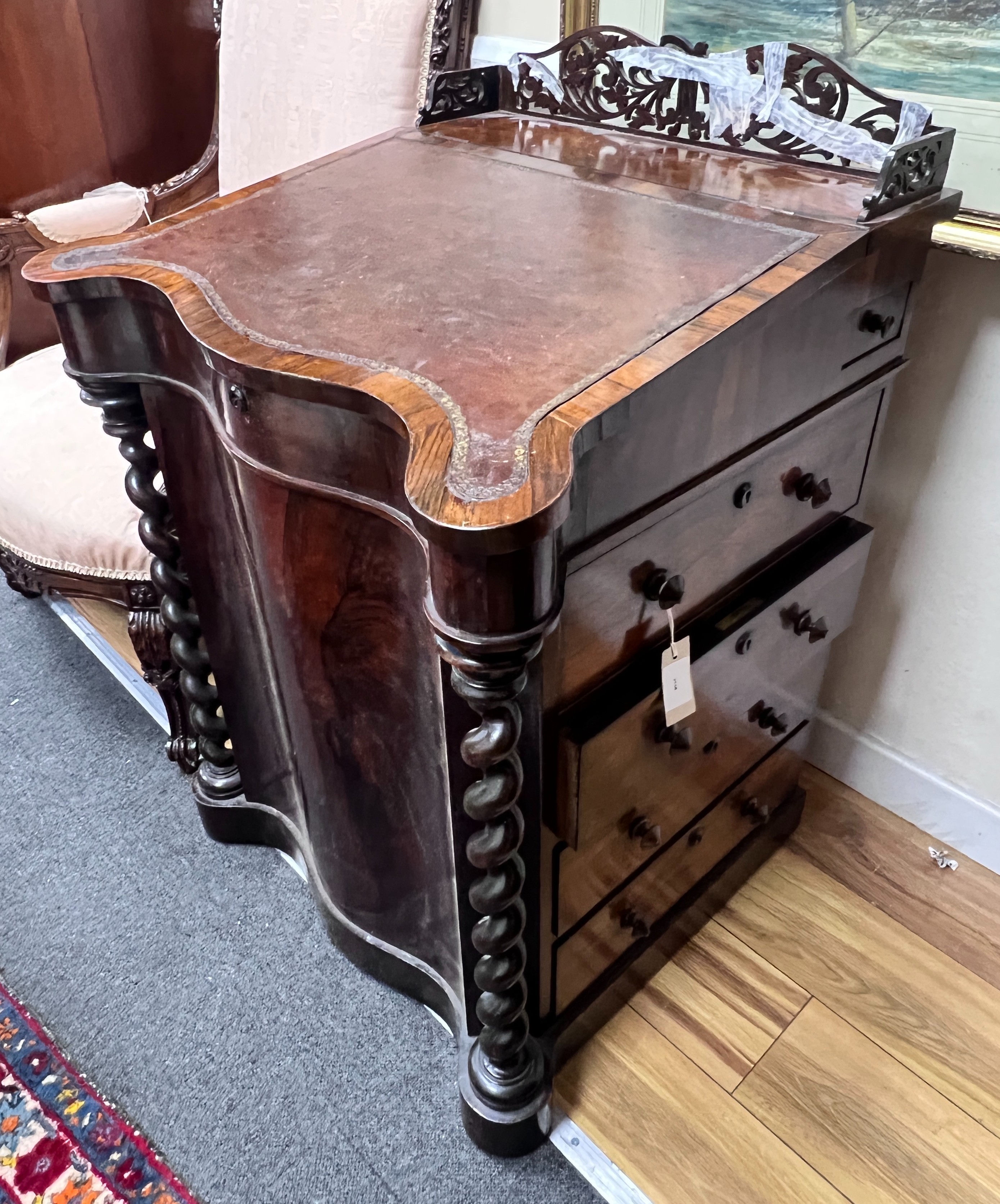 An early Victorian rosewood serpentine fronted Davenport, width 63cm, depth 58cm, height 92cm